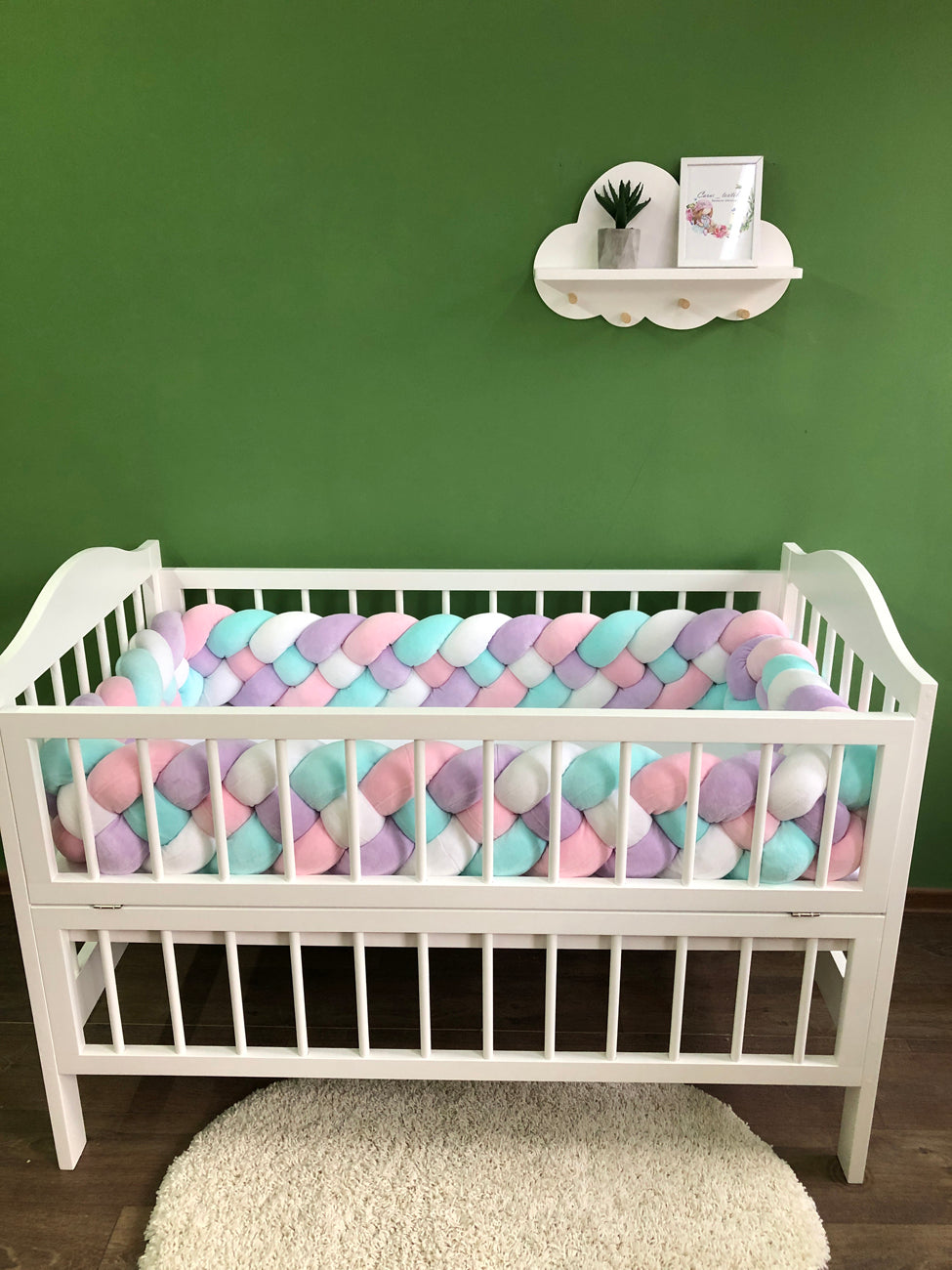 Braided bed bumpers in pink, lilac, white and cyan colors for crib