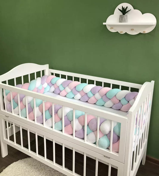 Braided bed bumpers in pink, lilac, white and cyan colors for crib