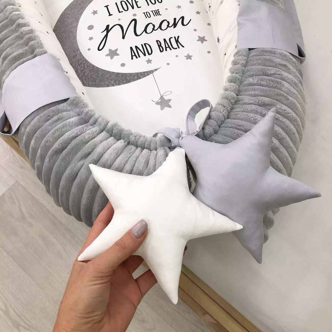 Gray baby nest lounger with the baby blanket