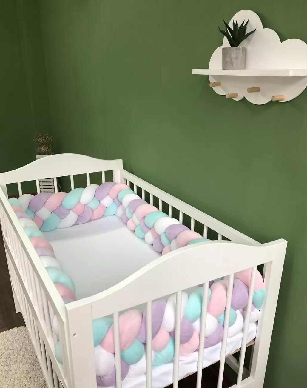 Braided bed bumpers in pink, lilac, white and cyan colors for crib